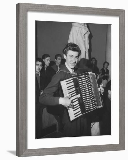 Science Student Playing the Accordian-Ed Clark-Framed Photographic Print