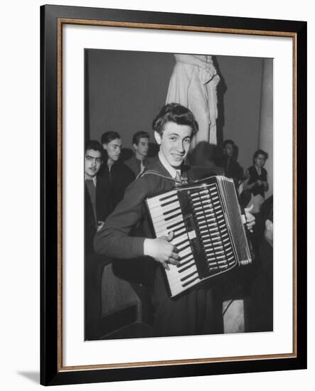 Science Student Playing the Accordian-Ed Clark-Framed Photographic Print