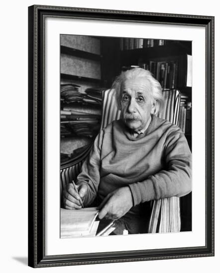 Scientist Albert Einstein Wearing Old Sweat Shirt, Sitting with Page of Equations in Home Library-Alfred Eisenstaedt-Framed Premium Photographic Print