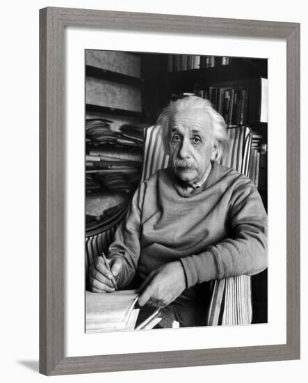Scientist Albert Einstein Wearing Old Sweat Shirt, Sitting with Page of Equations in Home Library-Alfred Eisenstaedt-Framed Premium Photographic Print