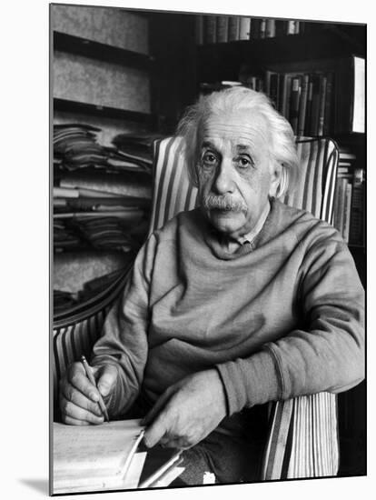 Scientist Albert Einstein Wearing Old Sweat Shirt, Sitting with Page of Equations in Home Library-Alfred Eisenstaedt-Mounted Premium Photographic Print