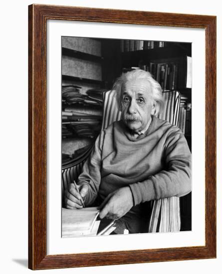 Scientist Albert Einstein Wearing Old Sweat Shirt, Sitting with Page of Equations in Home Library-Alfred Eisenstaedt-Framed Premium Photographic Print