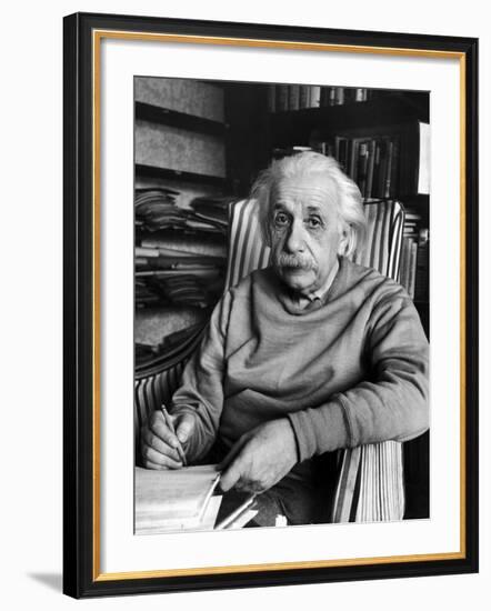 Scientist Albert Einstein Wearing Old Sweat Shirt, Sitting with Page of Equations in Home Library-Alfred Eisenstaedt-Framed Premium Photographic Print