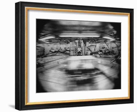 Scientist Jiro Oyama Observing Whirling Cages of Centrifuge Containing Animals-Ralph Crane-Framed Photographic Print