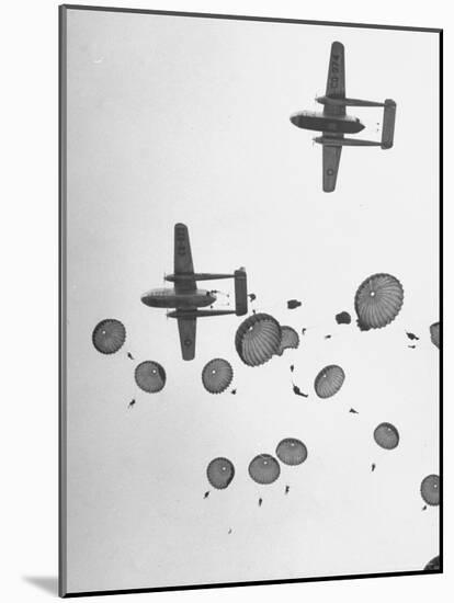 Scores of Paratroopers Dropping from C-82 "Flying Boxcar" and Landing on Level Ground-Frank Scherschel-Mounted Photographic Print