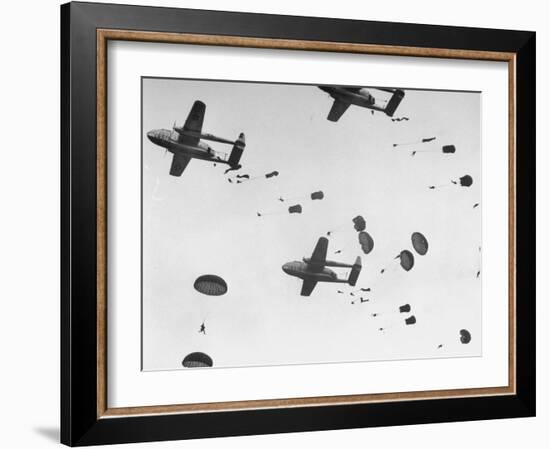 Scores of Paratroopers Dropping from C-82 "Flying Boxcar" and Landing on Level Ground-Frank Scherschel-Framed Photographic Print