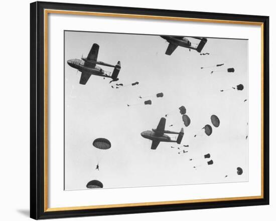 Scores of Paratroopers Dropping from C-82 "Flying Boxcar" and Landing on Level Ground-Frank Scherschel-Framed Photographic Print