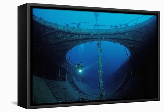 Scuba Diver Exploring a Shipwreck, Papua New Guinea, Coral Sea.-Reinhard Dirscherl-Framed Premier Image Canvas