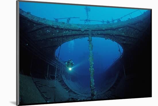 Scuba Diver Exploring a Shipwreck, Papua New Guinea, Coral Sea.-Reinhard Dirscherl-Mounted Photographic Print