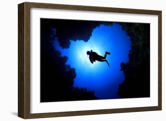 Scuba Diver Swims over Underwater Cave, Silhouette against Sun-Rich Carey-Framed Photographic Print