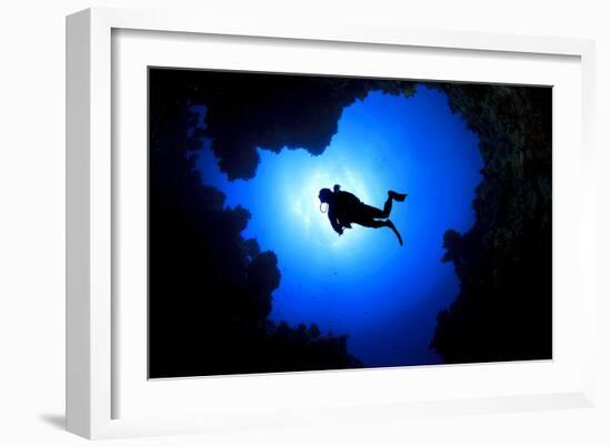 Scuba Diver Swims over Underwater Cave, Silhouette against Sun-Rich Carey-Framed Photographic Print