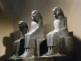 three seated figures