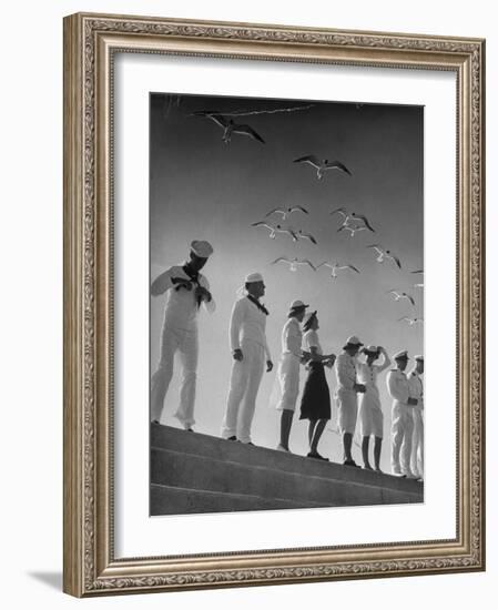 Seagulls Flying Above Group of Sailors and Waves-Alfred Eisenstaedt-Framed Photographic Print