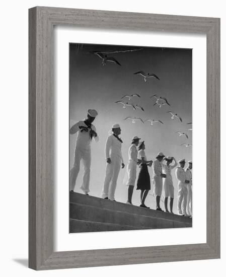 Seagulls Flying Above Group of Sailors and Waves-Alfred Eisenstaedt-Framed Photographic Print