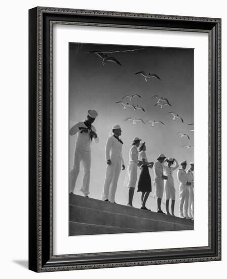 Seagulls Flying Above Group of Sailors and Waves-Alfred Eisenstaedt-Framed Photographic Print