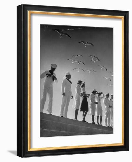 Seagulls Flying Above Group of Sailors and Waves-Alfred Eisenstaedt-Framed Photographic Print
