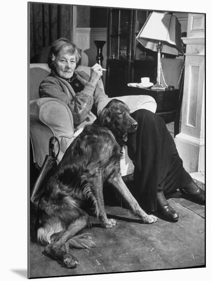 Sean Macbride's Mother, Maud Gonne Macbride, Sitting at Home with Her Dog-Tony Linck-Mounted Premium Photographic Print