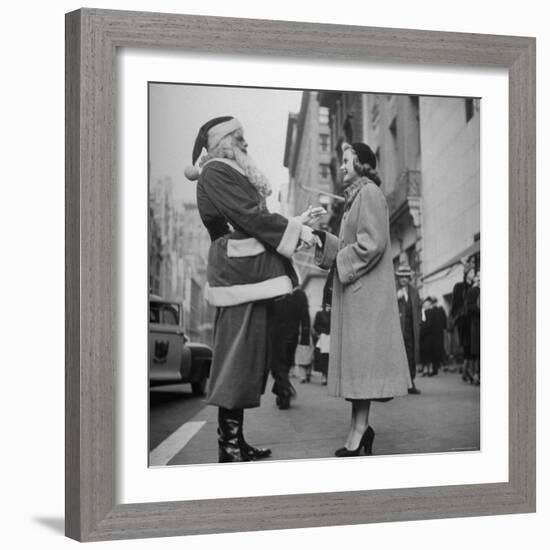 Secretary Eileen Godsil Talking with a Department Store Santa Claus on 5th Avenue-Martha Holmes-Framed Photographic Print