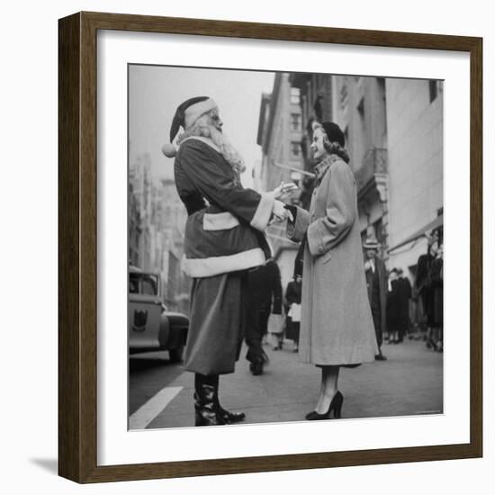 Secretary Eileen Godsil Talking with a Department Store Santa Claus on 5th Avenue-Martha Holmes-Framed Photographic Print