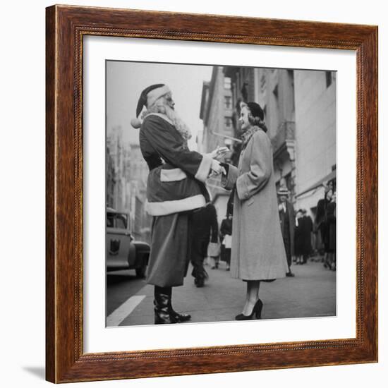 Secretary Eileen Godsil Talking with a Department Store Santa Claus on 5th Avenue-Martha Holmes-Framed Photographic Print