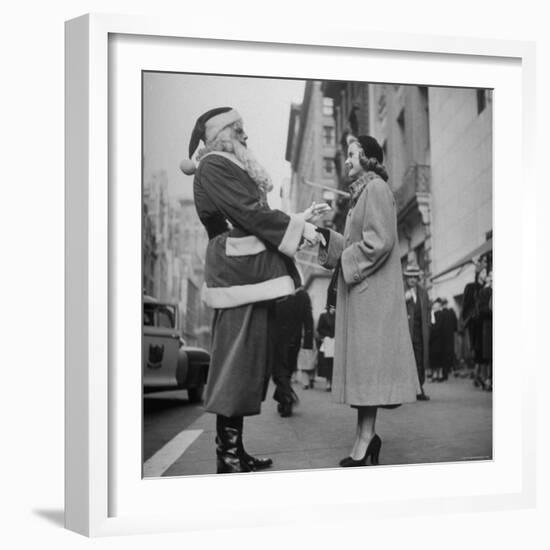 Secretary Eileen Godsil Talking with a Department Store Santa Claus on 5th Avenue-Martha Holmes-Framed Photographic Print