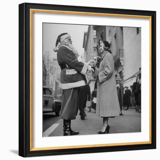 Secretary Eileen Godsil Talking with a Department Store Santa Claus on 5th Avenue-Martha Holmes-Framed Photographic Print