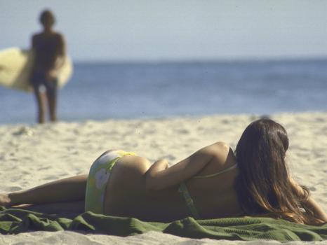 Seen from Her Back, Young Woman Lying on Beach Wearing Bikini Viewing  Ocean' Photographic Print - Co Rentmeester | Art.com
