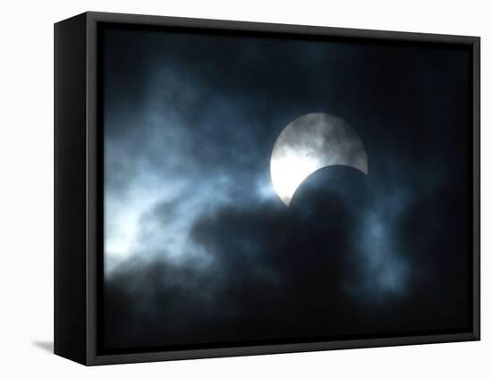 Seen Through Clouds the Sun is Partially Obscured by the Moon During an Eclipse-null-Framed Premier Image Canvas