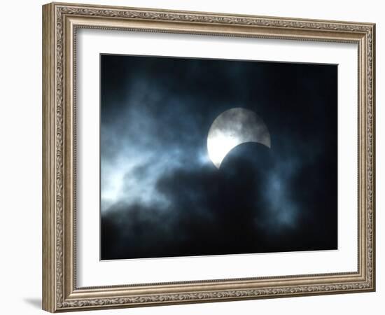 Seen Through Clouds the Sun is Partially Obscured by the Moon During an Eclipse-null-Framed Photographic Print