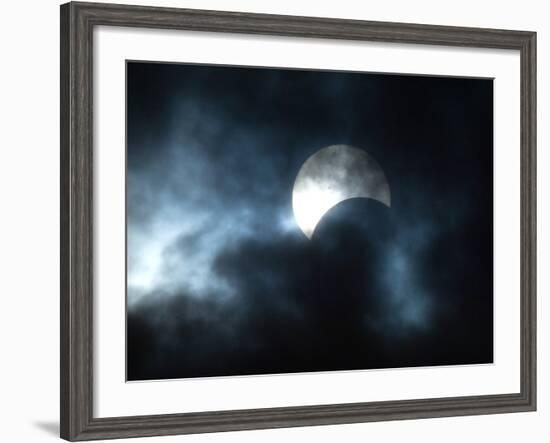 Seen Through Clouds the Sun is Partially Obscured by the Moon During an Eclipse-null-Framed Photographic Print