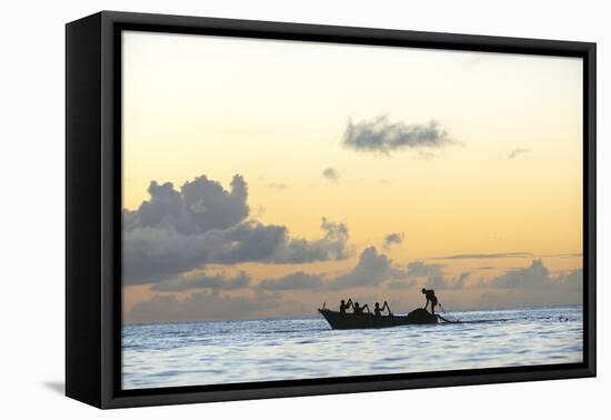 Seine fisherman lay their nets from a boat in Castara Bay in Tobago at sunset, Trinidad and Tobago-Alex Treadway-Framed Premier Image Canvas