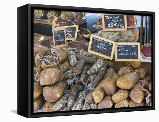 Selection of Corsican sausages and hams for sale at open-air market in Place Foch, Ajaccio-David Tomlinson-Framed Premier Image Canvas