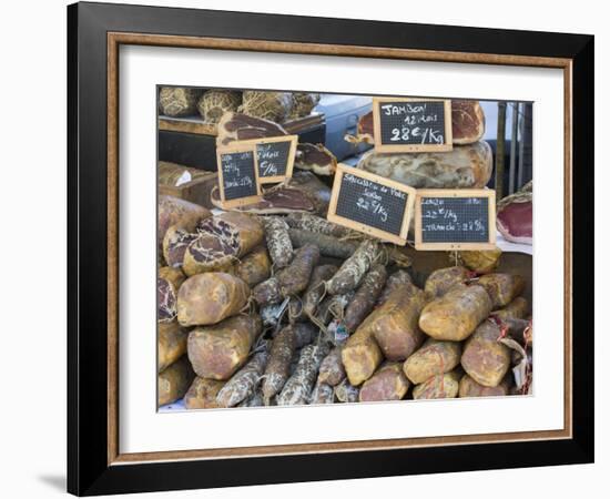 Selection of Corsican sausages and hams for sale at open-air market in Place Foch, Ajaccio-David Tomlinson-Framed Photographic Print