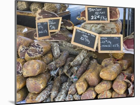 Selection of Corsican sausages and hams for sale at open-air market in Place Foch, Ajaccio-David Tomlinson-Mounted Photographic Print