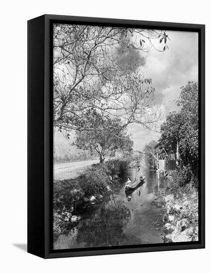 Seminoles Canoeing down Stream-null-Framed Premier Image Canvas