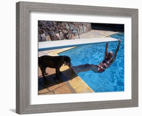 Sen. Barry Goldwater Hanging Underneath Diving Board in Swimming Pool as Dog Licks His Toes-Bill Ray-Framed Photographic Print