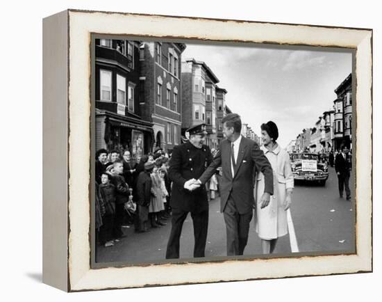 Sen. Jack Kennedy with Jackie, Walking Down Middle of the Street During Senate Re-Election Campaign-Carl Mydans-Framed Premier Image Canvas