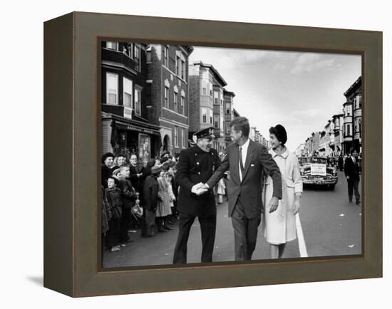 Sen. Jack Kennedy with Jackie, Walking Down Middle of the Street During Senate Re-Election Campaign-Carl Mydans-Framed Premier Image Canvas