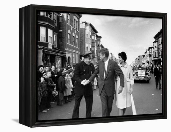 Sen. Jack Kennedy with Jackie, Walking Down Middle of the Street During Senate Re-Election Campaign-Carl Mydans-Framed Premier Image Canvas