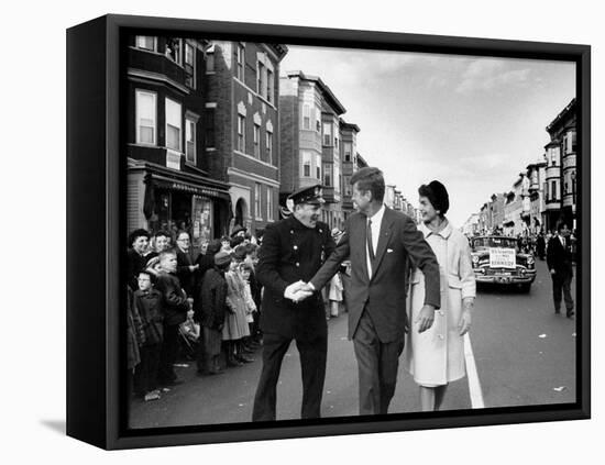 Sen. Jack Kennedy with Jackie, Walking Down Middle of the Street During Senate Re-Election Campaign-Carl Mydans-Framed Premier Image Canvas