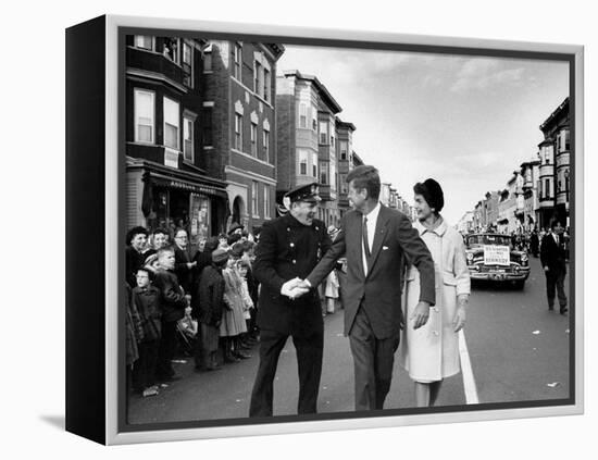 Sen. Jack Kennedy with Jackie, Walking Down Middle of the Street During Senate Re-Election Campaign-Carl Mydans-Framed Premier Image Canvas