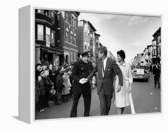 Sen. Jack Kennedy with Jackie, Walking Down Middle of the Street During Senate Re-Election Campaign-Carl Mydans-Framed Premier Image Canvas