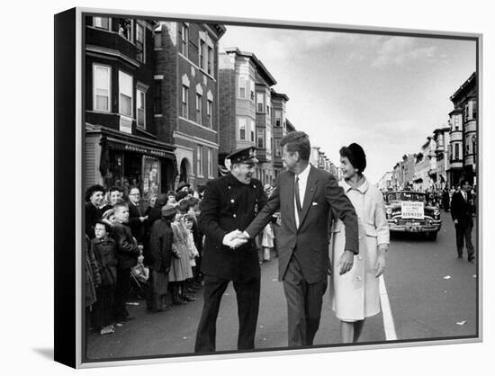 Sen. Jack Kennedy with Jackie, Walking Down Middle of the Street During Senate Re-Election Campaign-Carl Mydans-Framed Premier Image Canvas