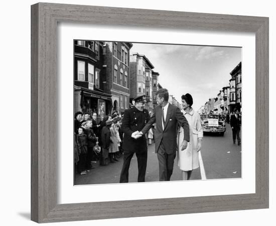 Sen. Jack Kennedy with Jackie, Walking Down Middle of the Street During Senate Re-Election Campaign-Carl Mydans-Framed Photographic Print