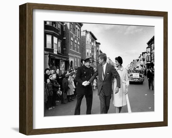 Sen. Jack Kennedy with Jackie, Walking Down Middle of the Street During Senate Re-Election Campaign-Carl Mydans-Framed Photographic Print