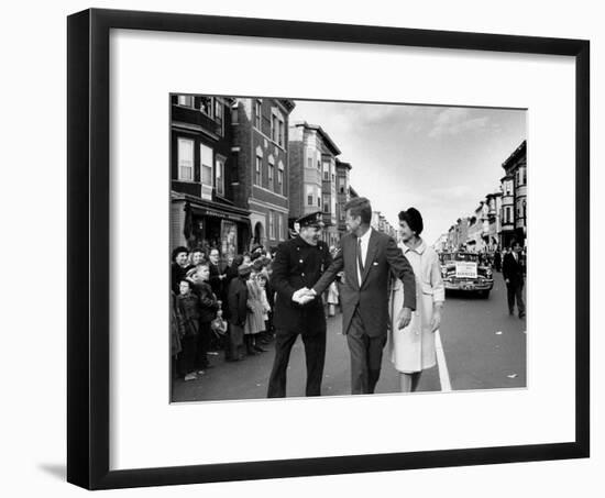 Sen. Jack Kennedy with Jackie, Walking Down Middle of the Street During Senate Re-Election Campaign-Carl Mydans-Framed Photographic Print