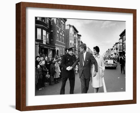 Sen. Jack Kennedy with Jackie, Walking Down Middle of the Street During Senate Re-Election Campaign-Carl Mydans-Framed Photographic Print