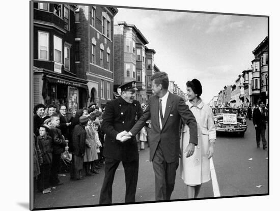 Sen. Jack Kennedy with Jackie, Walking Down Middle of the Street During Senate Re-Election Campaign-Carl Mydans-Mounted Photographic Print