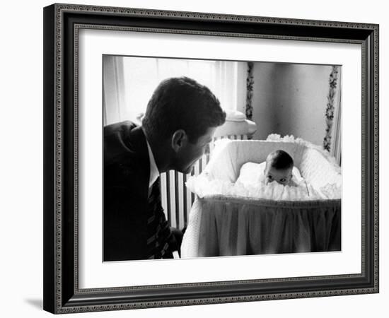 Sen. John F. Kennedy Playing Peek-A-Boo with His Daughter Caroline in Her Crib-Ed Clark-Framed Photographic Print