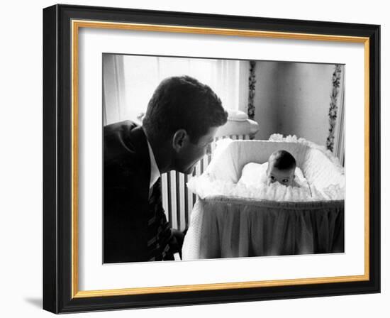 Sen. John F. Kennedy Playing Peek-A-Boo with His Daughter Caroline in Her Crib-Ed Clark-Framed Photographic Print